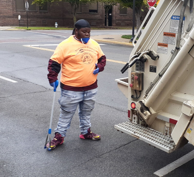 New Vision Youth members volunteer at downtown cleanup